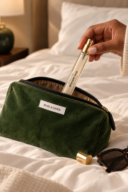 Opulent Oud Travel Eau de Parfum with ROSE & HERB wash bag on a hotel bed